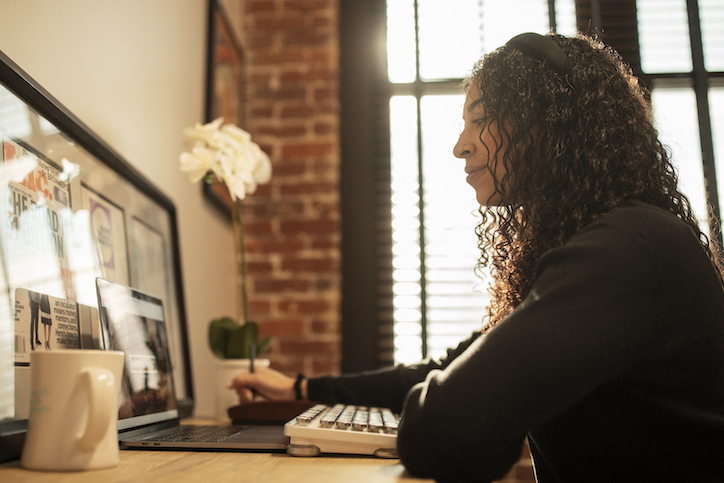 Sales rep watching training on laptop